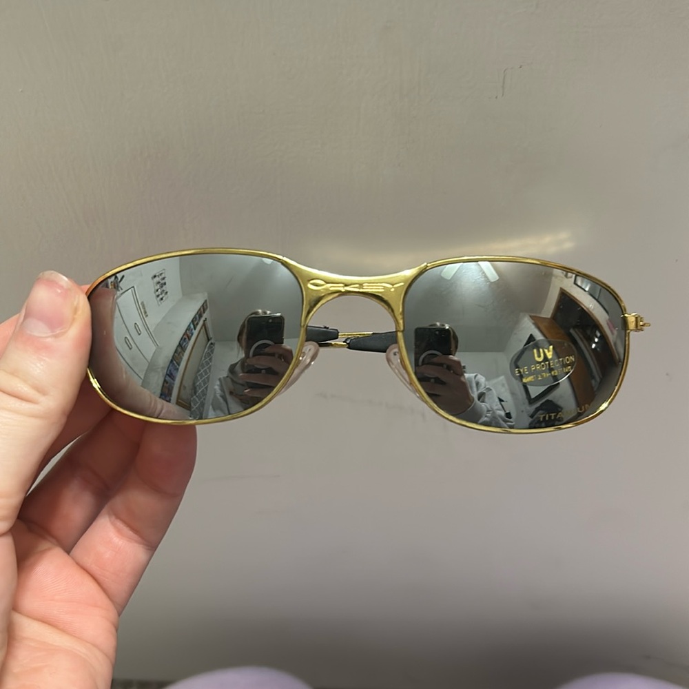 Gold Oakley sunglassess
